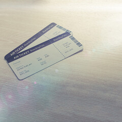 Airline tickets on wooden background
