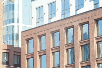 Horizontal full-color photo. Textural composition with parts of facades of city buildings. Urban landscape.