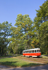 Fototapeta na wymiar Red tram in Pushcha-Vodytsya, Kyiv region, Ukraine