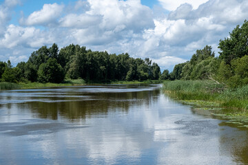 Fototapeta na wymiar Emajogi, the largest river in Estonia. flows through the second largest city, Tartu. Summer time beautiful scenic environment