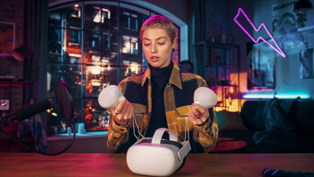 Beautiful Young Female Talking Into Microphone While Recording a Podcast About a Virtual Reality Set. Confident Girl with Short Hair Explaining New Features Live on Social Media Review.