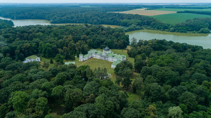Fototapeta na wymiar Aerial view palace in kachanivka, beautiful nature forest and lake. Drone wide shot park and river