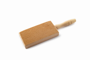Wooden utensil for cooking gnocchi isolated on a white background.