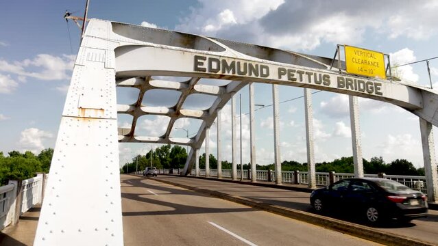 Edmund Pettus bridge in Selma, Alabama with cars driving.