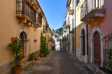 A narrow street between the old stone houses of Cansano, a medieval village in the Abruzzo region of Italy.	