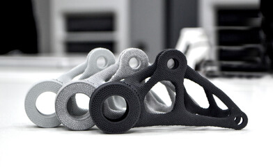 Black white gray models printed on 3D printer in laboratory office. Objects printed on 3D printer...