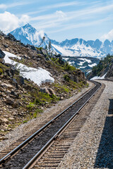 Fototapeta premium The rail tracks at the highest point of the White Pass near Skagway, Alaska in summertime
