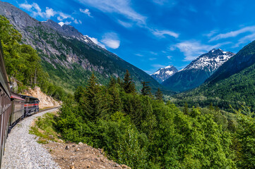 A view travelling down from the highest point of the White Pass near Skagway, Alaska in summertime