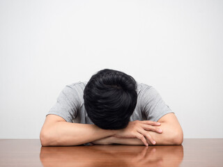 Man tried form working laying at table white background