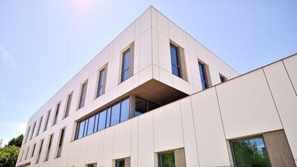 Office building with white aluminum composite panels. Facade wall made of glass and metal. Abstract...