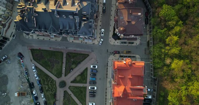 Aerial top view Kyiv roofs on the streets at beautiful sunset or sunrise. Drone shot old Kiev - podil