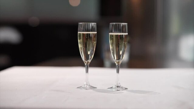 two glasses of sparkling cava on a restaurant table