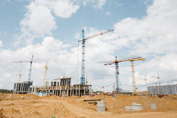 Industrial background. Building construction site work against blue sky