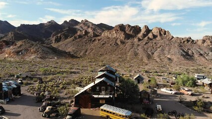 Nelson Ghost Town Nevada Drone Footage. A sight in the desert with rusty antiques in between rocks. Good road trip and tourist attraction near Las Vegas. 