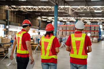 Warehouse worker walking and talking while checking product in warehouse, Logistic industry concept.