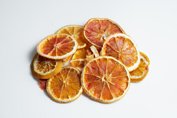 Natural Dried Oranges Slices Snack. Dried Oranges for baking. Dried grapefruit, slices and dried candie citrus fruit.  Isolated white background.
