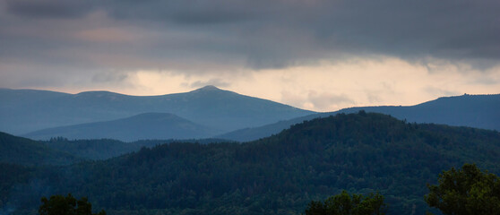 Misty sunset over the Karkonosze Mountains. Poland