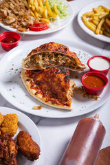 Kebab calzone and various fast food dishes