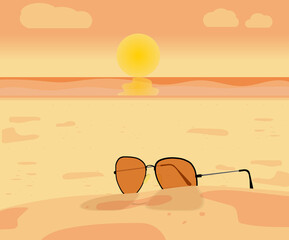 Fototapeta na wymiar Sunglass on the beach, at sunset