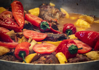 ragout with meat on the frying pan