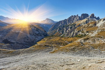 Mountain path Tre Cime National Park on autumn day, Dolomites Mountains, Italy