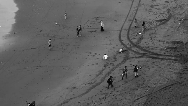 people walking on the beach