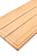 Wooden cutting board isolated above white background