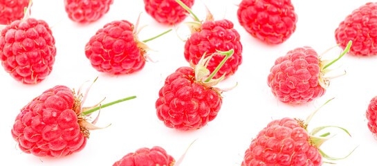 Background of ripe pink raspberries on a white background.