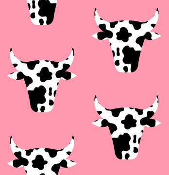Vector seamless pattern of flat cow head with cow print isolated on pink background
