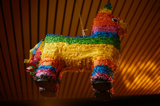 Festive multi-colored pinata in the form of a llama. Mexican hollow toy 