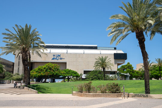 Tel Aviv, Israel - July 1, 2022: Building of the Anu Museum of the Jewish People with grren meadow and palm trees on the foreground
