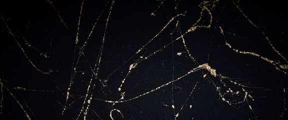 Gold and black marble art pattern. Textured abstract background.