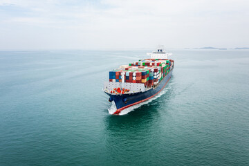 cargo container ship sailing in sea import and export business and industry logistic goods...