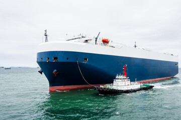 Roll-on Roll-of  ship loading new cars line up . Automotive container carriers floating in sea, business services import export international by Roll-on Roll-of ship large in the Ocean freight,