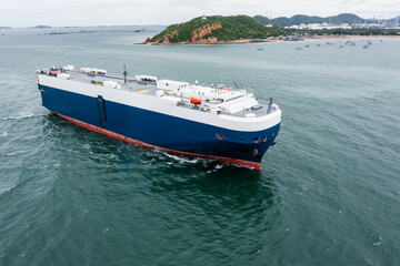 Obraz premium Roll-on Roll-of ship loading new cars line up . Automotive container carriers floating in sea, business services import export international by Roll-on Roll-of ship large in the Ocean freight,