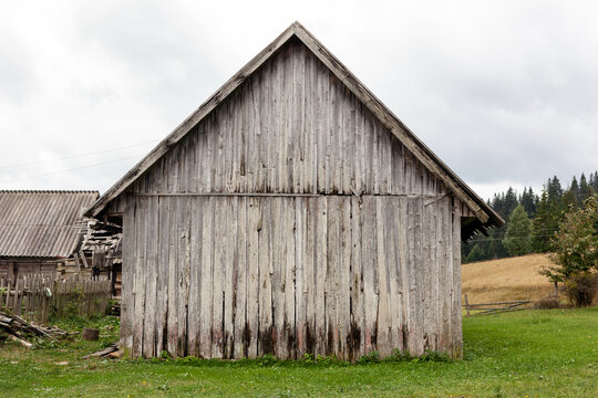 Old barn made of vertical planks.