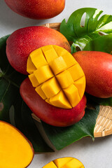 Mango background design concept. Top view Diced fresh mango fruit on gray table.