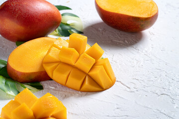 Mango background design concept. Top view Diced fresh mango fruit on white table.