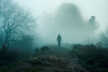 A giant spooky entity, emerging from the fog. As a person looks up. On a bleak winters day in the...