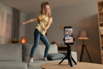 Blogger Kid Girl Dancing Filming On Mobile Phone At Home