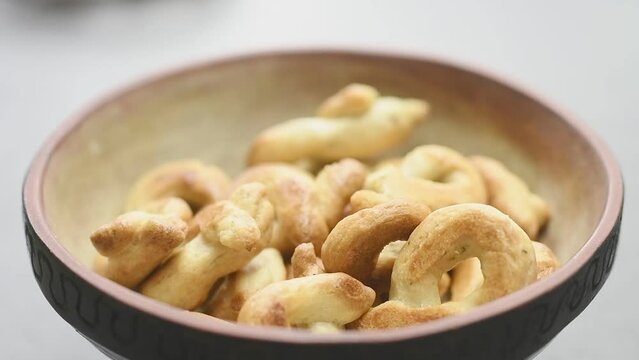 Serving taralli with oregano in a bowl.