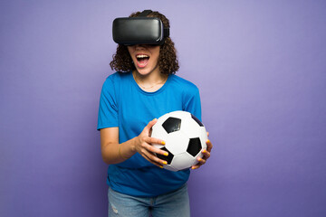 Cheerful woman watching her favorite soccer team with virtual reality glasses