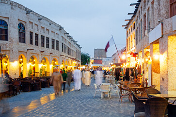 Tourists and shoppers outside the Souq Waqif in the heart of downtown Doha, Qatar