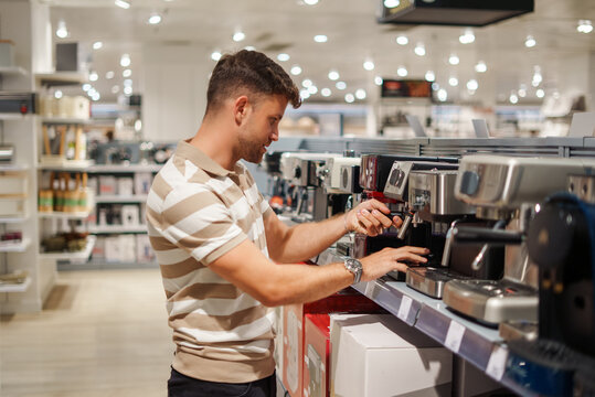 Man choosing coffee machine in mall