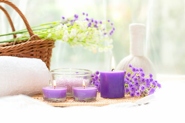 Obraz na płótnie Canvas Spa beauty massage health wellness background.  Spa Thai therapy treatment aromatherapy for body woman with purple flower nature candle for relax and summer time