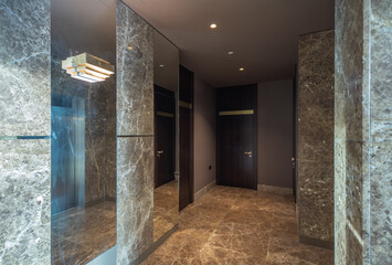 Modern marble interior of entrance hall in luxury residential building