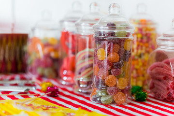 candy in a glass jar - Powered by Adobe