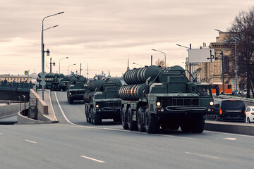 Military air defense equipment rides through the city. Russian missile complex based on automotive technology.