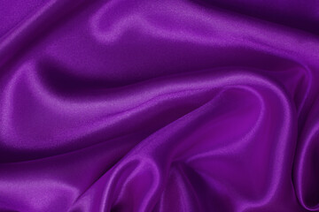 Dark purple fabric texture background, detail of silk or linen pattern.
