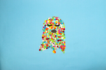 ghost lady isolated on pastel blue background, creative idea, colorful chopped paper ghost, modern...